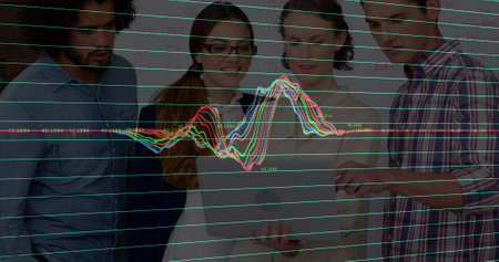 Image of data processing against group of diverse colleagues discussing over a laptop at office....