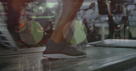 Image of statistical data processing over low section of woman running on treadmill at the gym. Sports fitness and business data technology conceptの写真素材