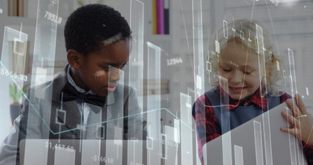 Image of financial data processing over diverse children using laptops at office. Global business, communication, finances and digital interface concept digitally generated image.の写真素材