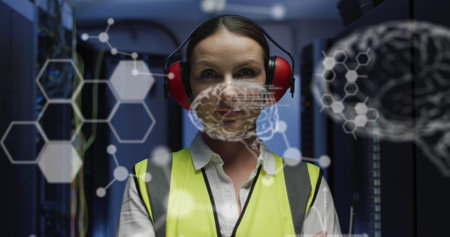 Image of medical data processing over caucasian female engineer standing at server room. Medical research science and business data storage technology conceptの写真素材