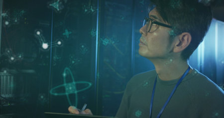 Image of molecule structures, asian man checking data server using digital tablet in server room. Digital composite, multiple exposure, anatomy, medical, technology and network server concept.の写真素材
