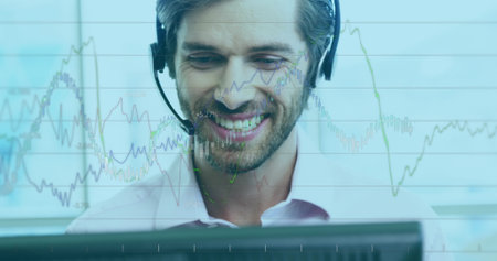 Image of financial graphs over diverse male consultants with headphones working in office. global...