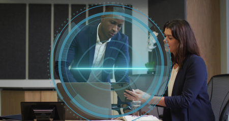 Image of data processing over diverse business people in office. global business, finances, computing and data processing concept digitally generated image.の写真素材