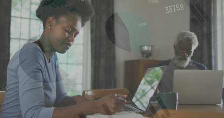 Image of statistical data processing against african american woman taking notes at home. Home...