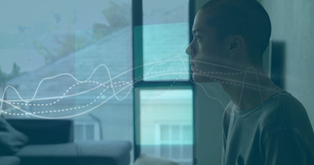 Image of graphs and squares over thoughtful biracial man eating at home. Digital composite, multiple exposure, report, business, abstract and food concept.の写真素材