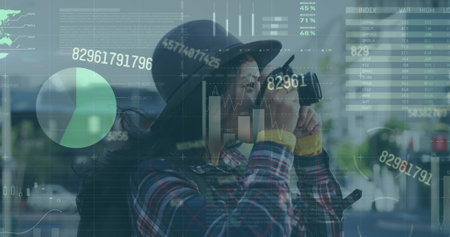 Image of infographic interface, changing numbers, asian woman clicking pictures through camera. Digital composite, multiple exposure, report, business, memories, global and technology concept.の写真素材