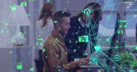 Image of globes of digital icons spinning against two diverse man and woman discussing at office....