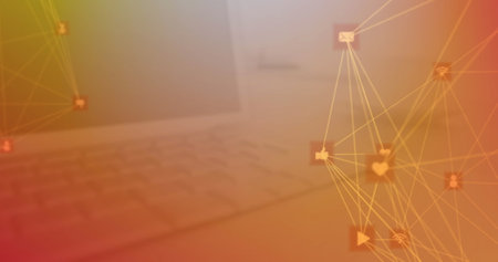 Image of two globes of digital icons spinning against close up of a laptop on table. Global networking and business technology conceptの写真素材