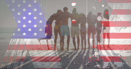 American flag with glitch effect against group of friends standing together at the beach. american independence patriotic holiday conceptの写真素材