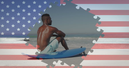 Image of fireworks and american flag jigsaw puzzles revealing man sitting on beach. usa patriotism and democracy concept digitally generated image.の写真素材