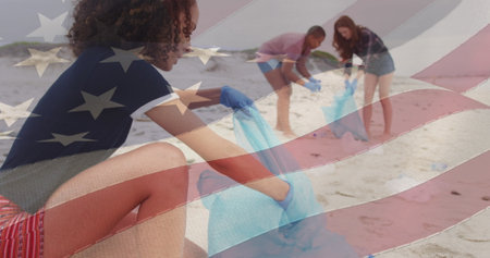 Image of flag of united states of america over people recycling on beach. american history, patriotism and independence concept digitally generated image.の写真素材