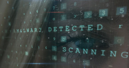 Young Caucasian female looking at computer screen with malware detection message. Digital code and scanning text overlaying her focused face in a dimly lit roomの写真素材