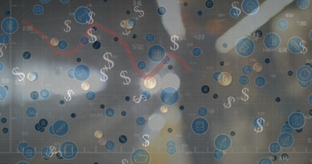 Digital icons and symbols related to finance and technology overlaying blurred background. The scene suggests a focus on financial data and market trendsの写真素材