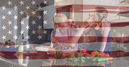 Independence text and american flag waving against caucasian mother and daughter feeding each other. american independence and celebration conceptの写真素材