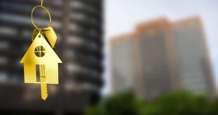 Image of golden key and house over cityscape. Moving house and business concept digitally generated image.の写真素材