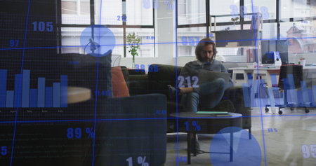 Image of statistical data processing against caucasian man using laptop at office. Computer...