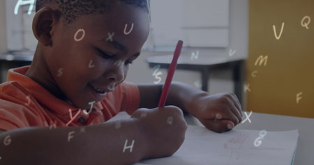 Image of looping letter over african american boy writing in book at classroom. Digital composite, multiple exposure, growth, business, childhood, education and school concept.の写真素材