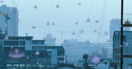Image of network of digital icons against aerial view of cityscape. Global networking and business technology conceptの写真素材