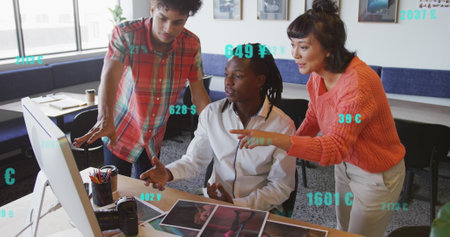 Image of changing numbers with currency symbols, diverse coworkers discussing reports on desktop. Digital composite, multiple exposure, business, growth, banking, teamwork and technology concept.の写真素材