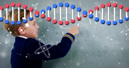 Image of dna strand and data processing over caucasian schoolboy. learning, science, digital interface and data processing concept digitally generated image.の写真素材