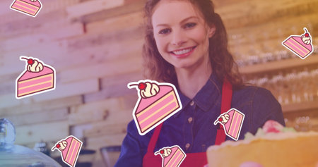 Image of cake icons over smiling caucasian female worker in baker. national cake day and celebration concept digitally generated image.の写真素材