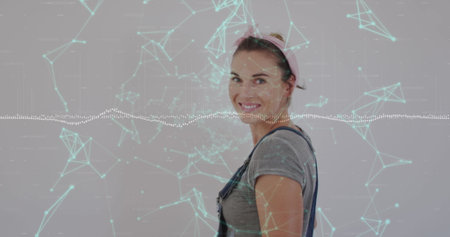 Image of network of connections and data processing over caucasian woman. Global connections digital interface and technology concept digitally generated image.の写真素材