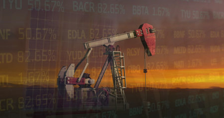 Image of financial data processing over oil rig at sunset. Global oil business, business, finances, computing and data processing concept digitally generated image.の写真素材