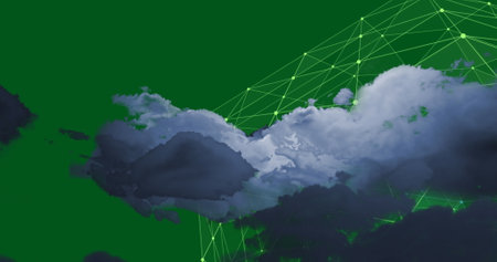 Image of clouds with data processing and connections on green background. Global business, computing and data processing concept digitally generated image.の写真素材