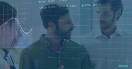 Image of statistical, stock market data processing over diverse colleagues discussing at office. Global economy and business data technology conceptの写真素材