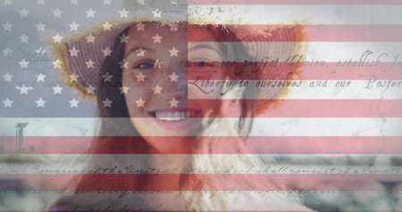 Constitution text and american flag against portrait of caucasian woman smiling in background....