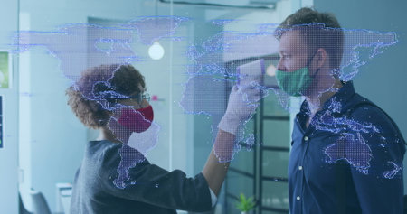 Image of purple world map over biracial woman in face mask taking temperature of caucasian man. Global covid 19 pandemic and business concept digitally generated image.の写真素材