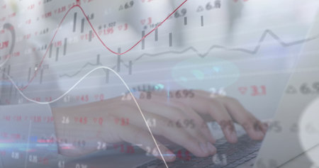 Image of stock market data processing over mid section of a woman using laptop at office. Global economy and business data technology conceptの写真素材