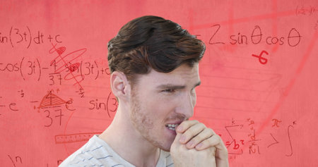 Image of stressed caucasian male student over maths equations and geometry on pink paper....