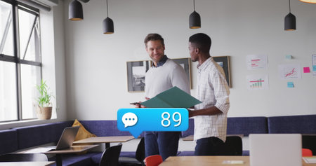 Image of numbers in notification bars, speech bubbles, diverse coworkers discussing reports. Digital...