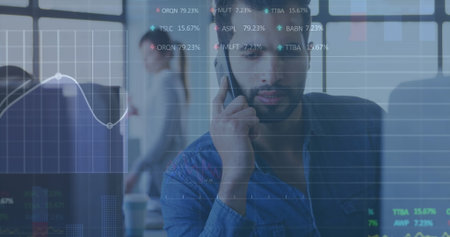 Image of stock market data processing against biracial man talking on smartphone at office. Global...