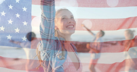 Image of flag of usa over happy diverse friends on beach in summer. American patriotism, diversity...