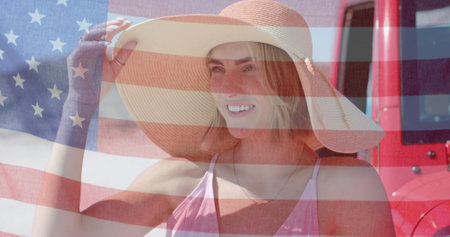 Image of flag of usa over caucasian woman by beach. American patriotism, diversity and vacation...