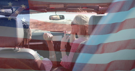 Image of flag of usa over diverse women in car by beach. American patriotism, diversity and vacation concept digitally generated image.の写真素材