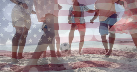Image of flag of usa and light trails over diverse friends playing football on beach. Patriotism and celebration concept digitally generated image.の写真素材