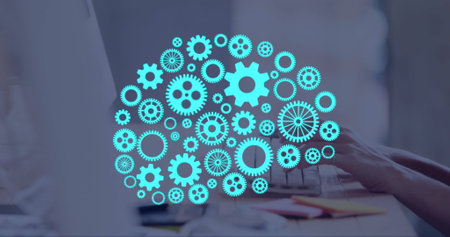 Image of ai brain with cogs over caucasian man typing on computer. Global artificial intelligence, data processing, computing and digital interface concept digitally generated image.の写真素材