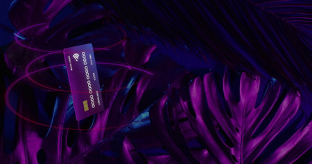 Credit card floating among vibrant tropical leaves, showcasing modern finance. banking, digital