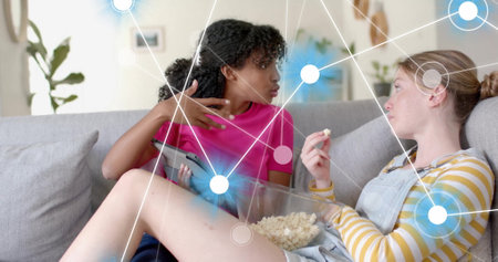 Image of network of connections over diverse women using tablet. Global artificial intelligence,...
