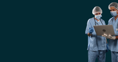 Image of diverse doctors discussing patient reports on laptop against black background. Digital composite, multiple exposure, profession, medical, teamwork, technology and healthcare concept.の写真素材