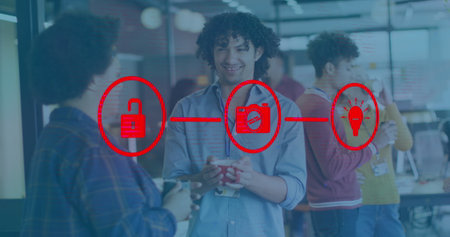 Image of connected icons over diverse coworkers discussing in tea break at office. Digital composite, multiple exposure, communication, ideas, beverages, drink and technology concept.の写真素材