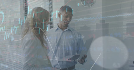 Image of graphs, loading circles, trading board, diverse coworkers discussing reports on laptop....