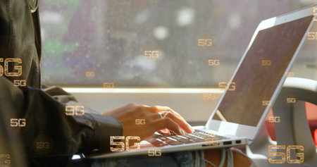 Image of multiple 5g text banners against mid section of a woman using laptop in a bus. Global...