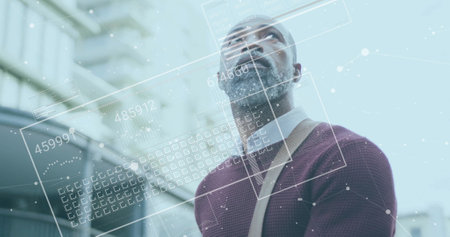 Image of financial data processing over african american man in city. Global finance, business,...
