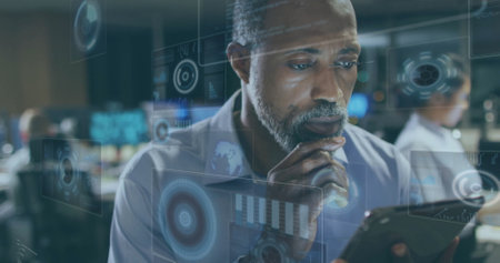 Image of financial data processing over african american businessman in office. Global finance,...