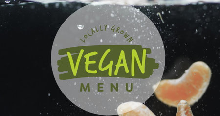 Image of vegan menu text over fruit falling in water background. Eating healthily, vegan food and fresh fruti concept digitally generated image.の写真素材