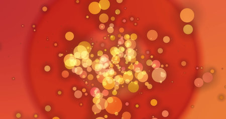 Image of yellow and orange bokeh circles of light floating on red and orange circles. movement,...